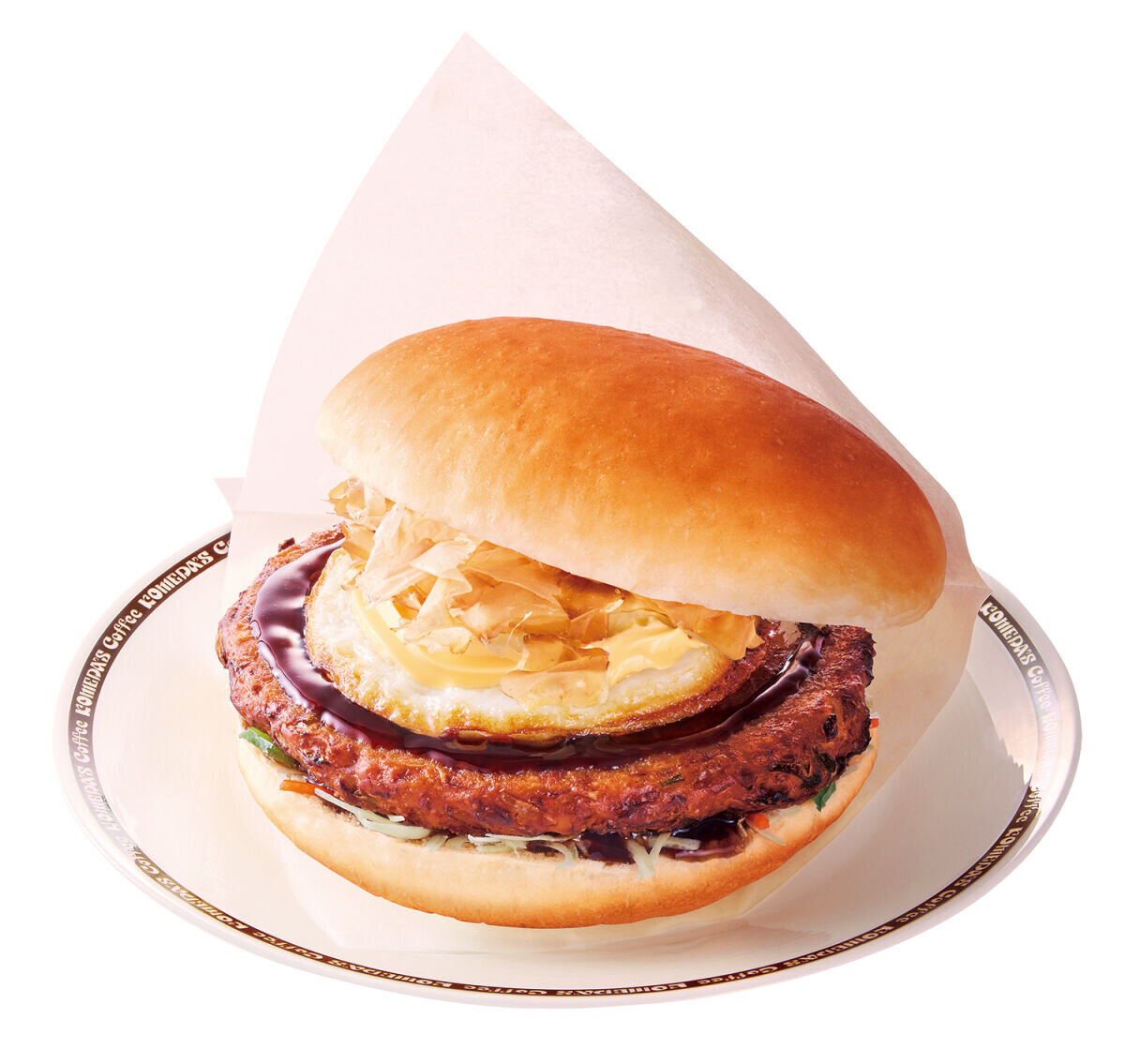 白い皿に盛り付けられた、紙に包まれたお好み焼バーガーのアップ