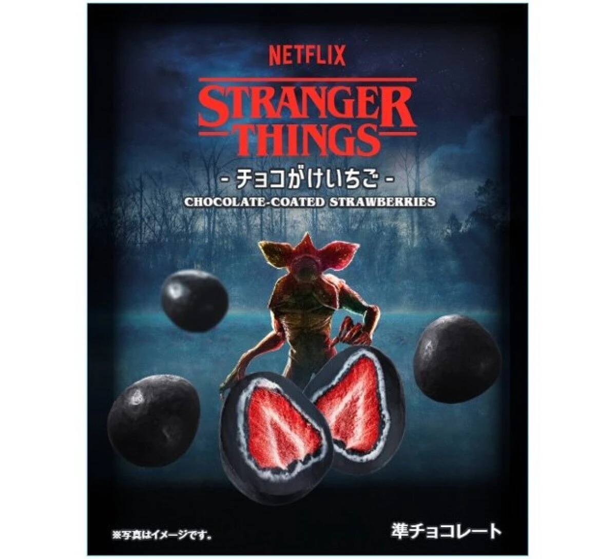 黒いパッケージにチョコがけいちごの断面とデモゴルゴンが描かれた商品画像
